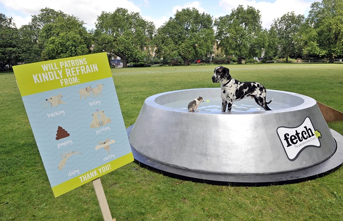 Fetch.co.uk, OcadoÕs online pet store, has built what could be the worldÕs largest dog bowl in London's Kennington Park, in a bid to educate the country about keeping our dogs hydrated in the summer. The giant dog bowl in London's Kennington Park, made by Fetch.co.uk, stretches 4.5m in diameter, stands at 1m tall and can hold up to 2000 litres of water, providing an ample thirst quencher for pooches this summer. For more info fetch@manifest.london 0203 137 9270 This photo may only be used in for editorial reporting purposes for the contemporaneous illustration of events, things or the people in the image or facts mentioned in the caption. Re-use of the picture may require further permission from the copyright holder. Photo credit should read: Adrian Brooks/Imagewise