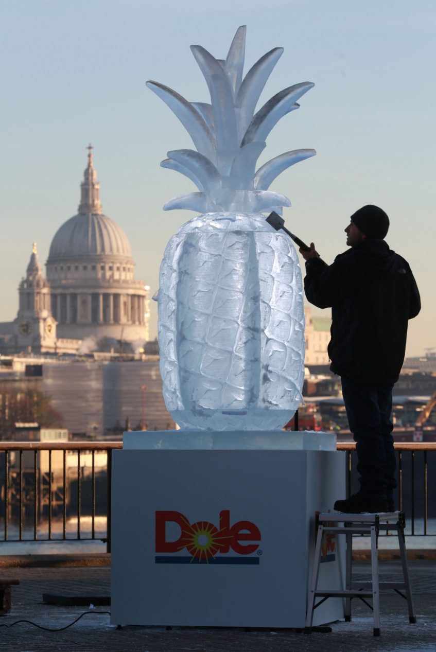EDITORIAL USE ONLY Percy Salazar-Diaz puts the finishing touches to giant DOLE ice sculptures which will today deliver smoothies made from DOLE Frozen Fruits on LondonÕs Southbank to mark the launch of a new range of frozen fruit, containing only ripe fruit, which has been picked and frozen within hours of being harvested. PRESS ASSOCIATION Photo. Picture date: Wednesday November 30, 2016. Photo credit should read: Matt Alexander/PA Wire
